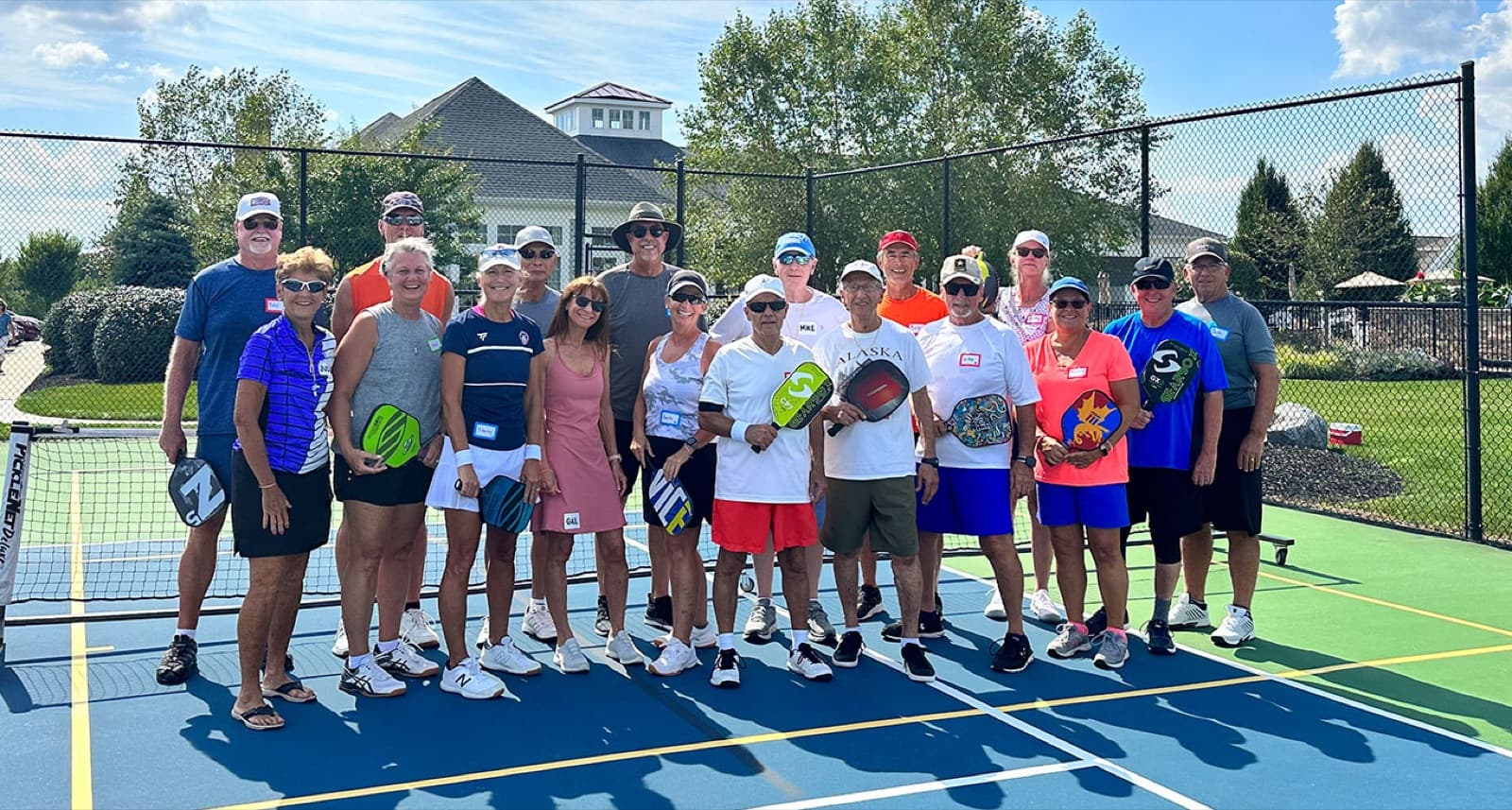 A beginner group lined up with paddles after camp
