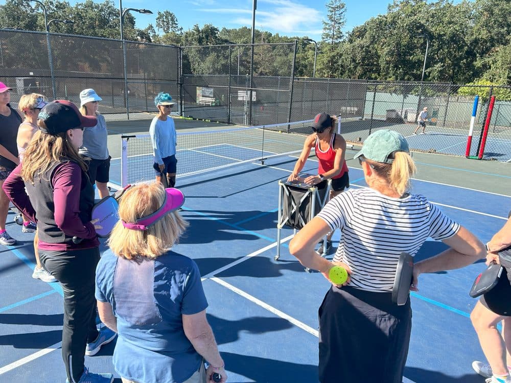 Carmen Sanz teaching a group clinic at Lafayette Tennis Club