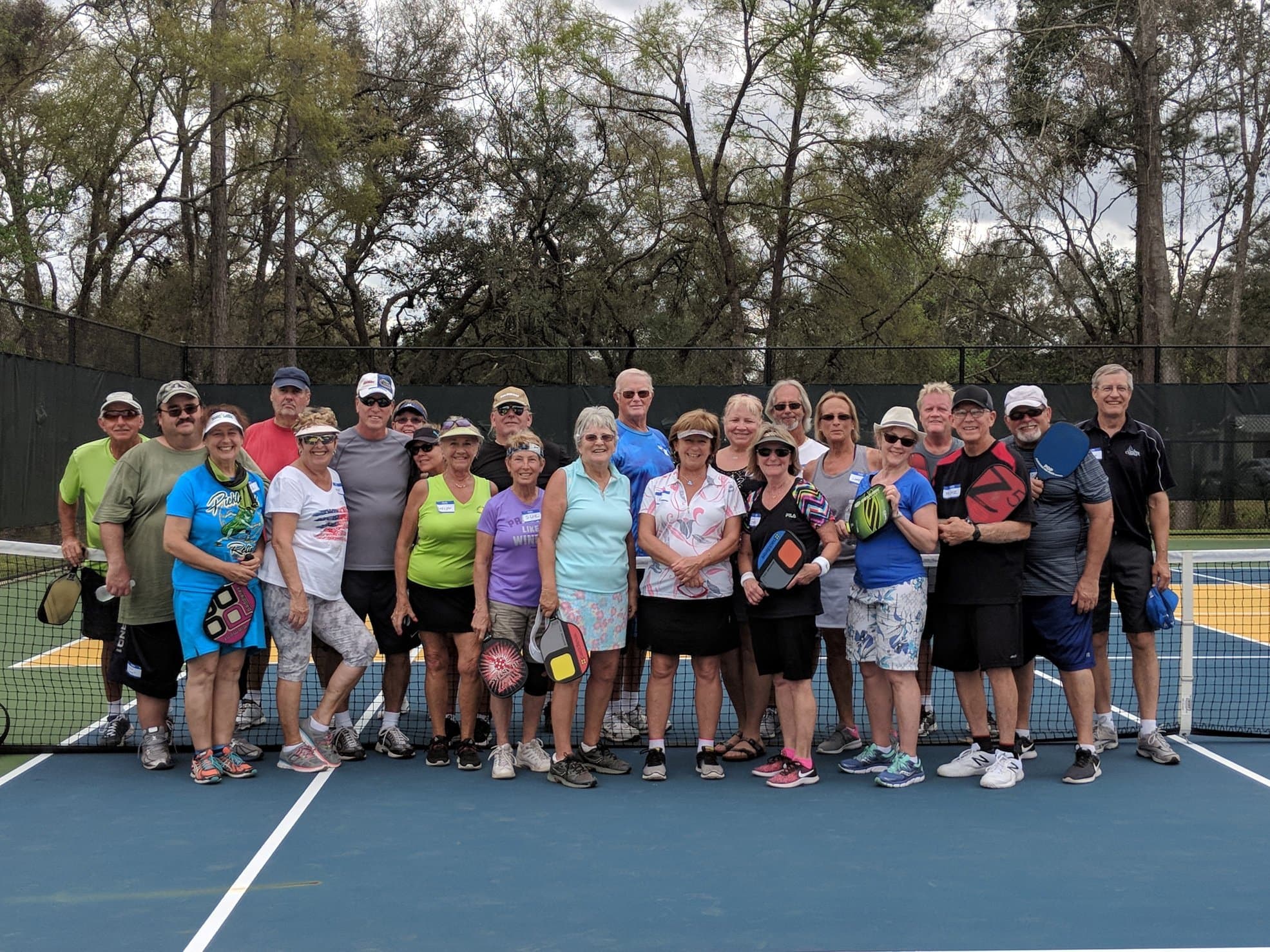 A group of players courtside after a session