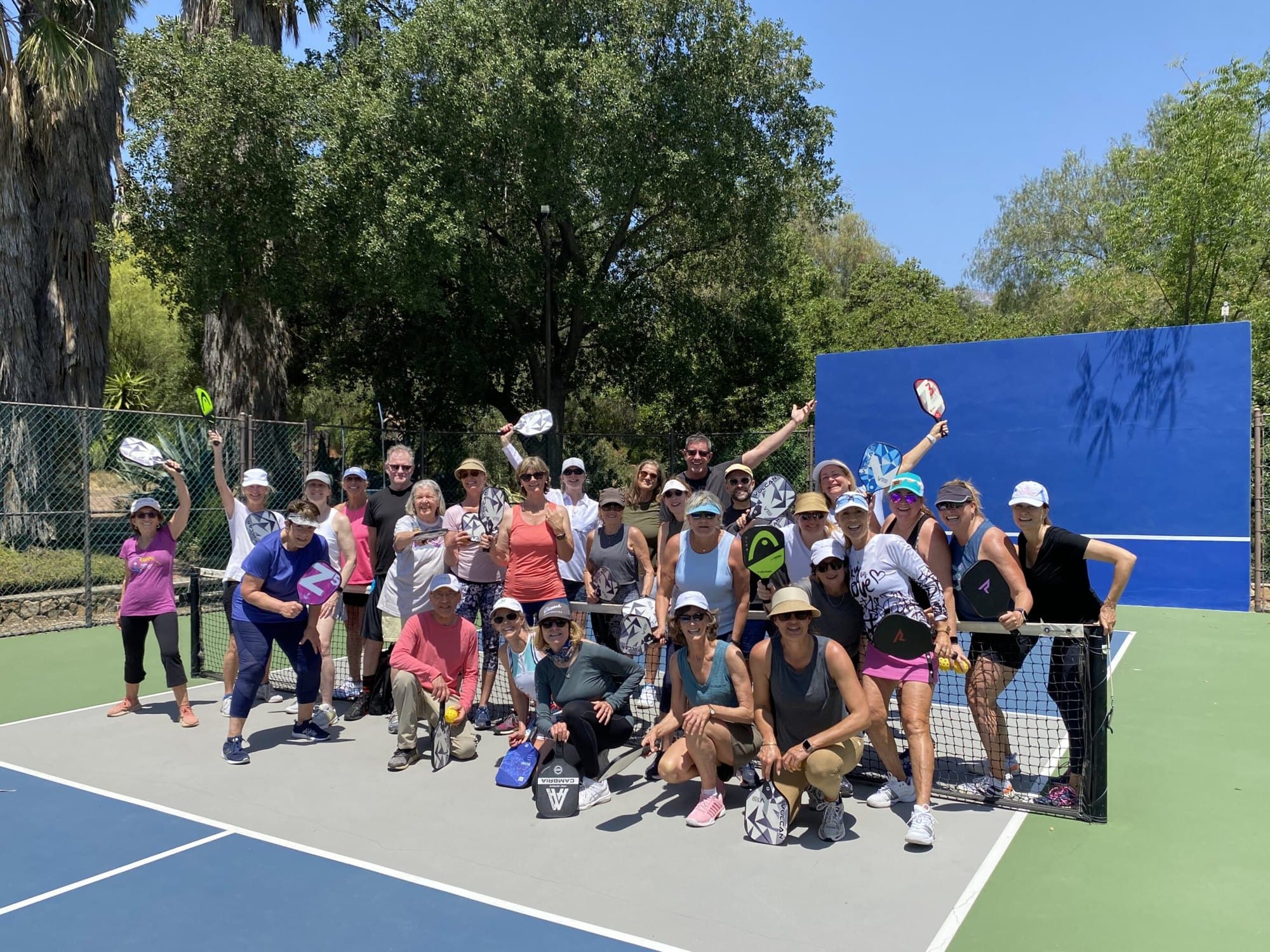 An outdoor camp group with their coach